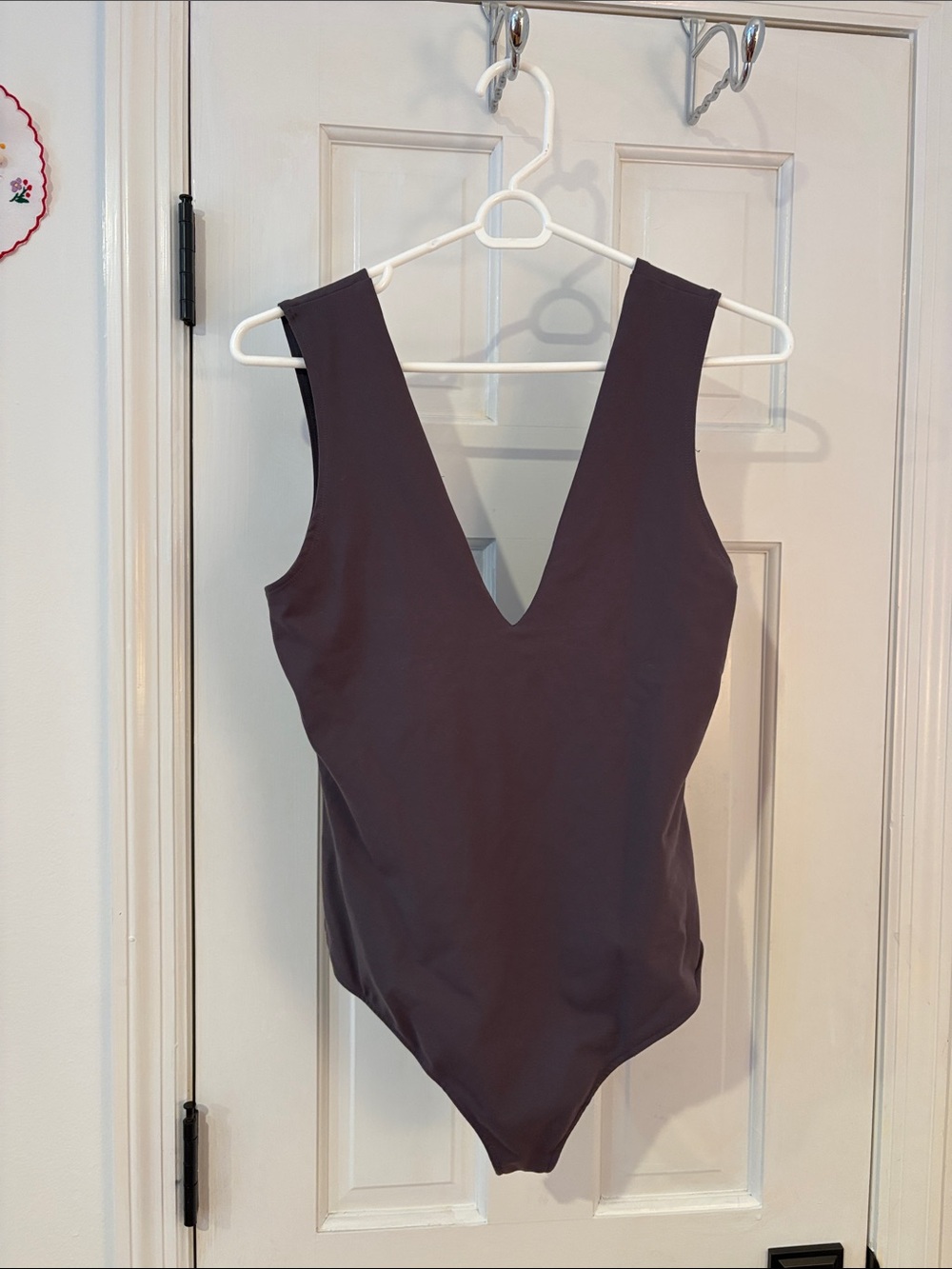 Plunge V-Neck body suit in grey. Free people